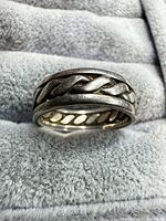 Front view of sterling silver braided ring showing braided design and oxidized finish