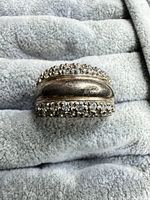 Front view of ring showing domed profile and CZ rows