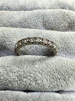 Front view of sterling silver eternity ring with CZ stones