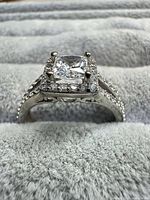 Profile view of sterling silver ring showing split shank and halo