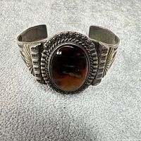 Front view showing brown agate stone and overall cuff design