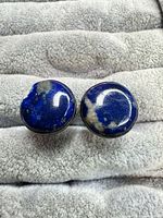 Front view of both round lapis lazuli cufflinks