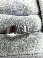 Front view showing 925 silver band and round solitaire stone