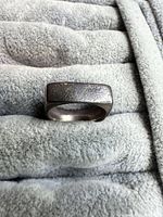 Front view of square sterling silver ring on fabric