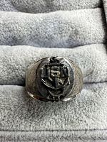 Front view of ring showing USN anchor design
