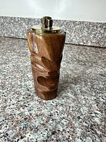 Front view showing carved Tiki face and wood grain