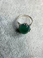 Full view of ring showing setting and stone