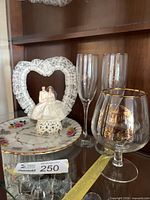 Full lot showing flutes, snifter, plate, topper