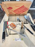 Lot overview showing spit basket in box, two Wiltshire utensils, sealed kebab set