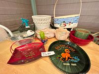 Overall lot showing trays, bowls, planters, baskets and figurine