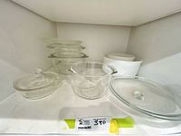 All bowls and lids arranged on shelf