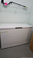 Front view of white Danby chest freezer closed