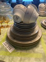 Stacked china showing plates and inverted cups