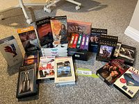 Group shot of all VHS tapes stacked and laid out, titles partially visible