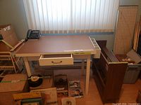 Desk front view showing drawer and legs