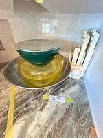 All bowls nested together with mandoline standing upright