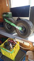 two mounted tires on shelf