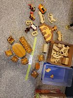 Lot overview showing miniature furniture set, vehicles, puzzle pieces, blocks