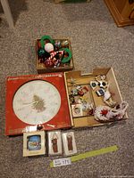 Overall lot showing clock box, trays of assorted Christmas ornaments and boxed decorations