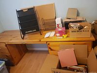 Wide view showing bulletin board, document sorter, letter tray, boxes of supplies