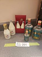 All seven perfume bottles grouped on countertop