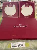Front of boxed placemat set and boxed casserole stands