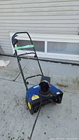 Full view of Snow Joe SJ620 snowblower showing handle, chute and housing