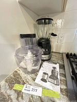 Motor base with blender jar, processor bowl, manual visible