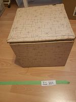 Beige cube record box with starburst pattern containing records