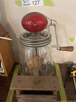 Full view of Dazey No.4 churn atop wooden butter press