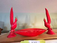 Full set: two red bird statues flanking red platter