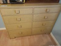 Front view of dresser with eight drawers closed