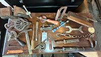 Top view showing all assorted tools including vise, pulleys, drills, wrenches, chain and handles
