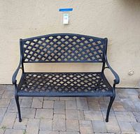 Front view of entire bench showing lattice pattern and finish