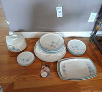 Full lot view showing dinner plates, salad and dessert plates, round platter, serving platters and covered bowl