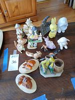 All figurines and plaques arranged on table, frontal view
