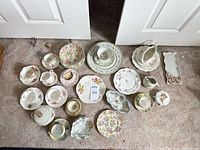 Full lot laid out showing all porcelain pieces