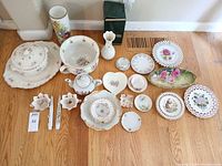 Group image showing all 22 porcelain and ceramic pieces