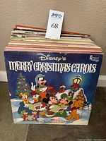 Stack of LPs with Disney Merry Christmas Carols cover visible