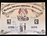 Front of souvenir card showing commemorative design, stamps, signatures