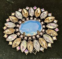 Front view showing opaline center, rhinestones, faux pearls, marquise arrangement