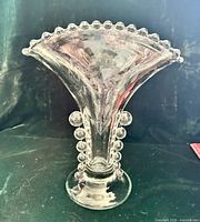 Full front view of clear glass vase showing flared shape, bead rows, etched Cornflower pattern