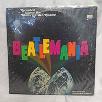 Front cover with Beatlemania title, shrink wrap present