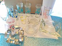 Group shot showing all glasses, ashtrays and cookie cutter ball