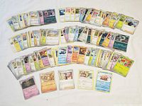 Spread of stacked and single Pokémon cards showing fronts and variety