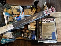 Overall view showing TEC grout bags, aluminum trim strip and assorted tiling supplies