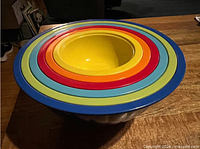 Top view of six nested melamine bowls showing colour sequence and condition