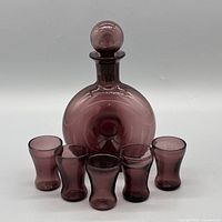 full view of decanter with stopper and five shot glasses