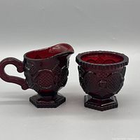 Creamer left, sugar bowl right, side profile