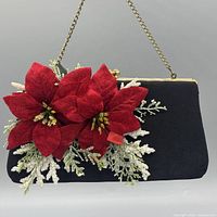 Front view showing red flowers, glitter foliage, gold hardware and chain strap